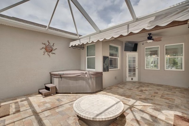 sunroom / solarium with a ceiling fan