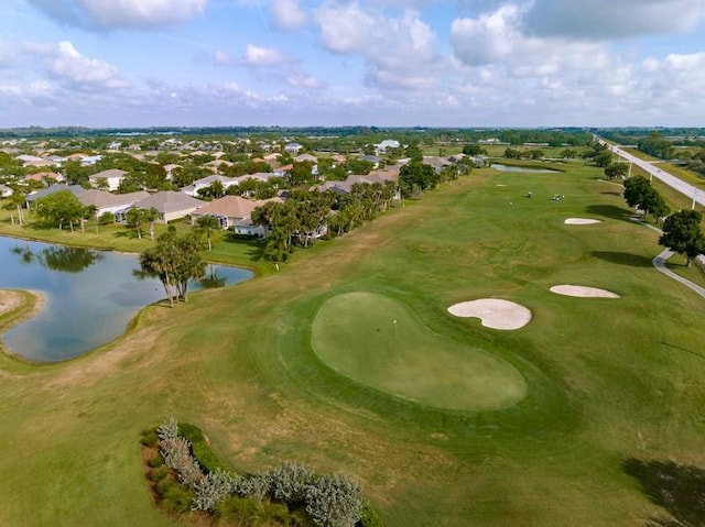 bird's eye view featuring a water view and golf course view