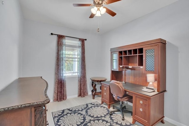 office area with baseboards and a ceiling fan