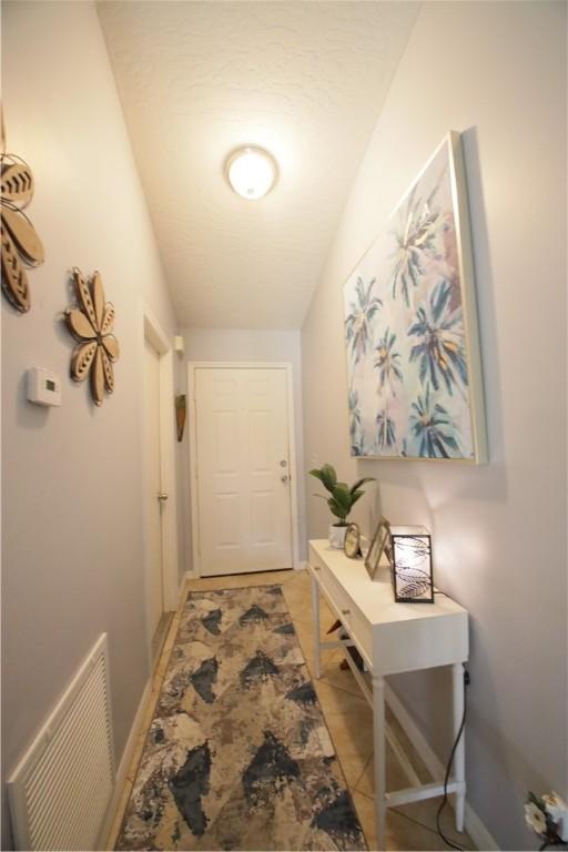 bedroom featuring light tile patterned floors and ceiling fan