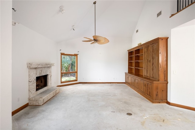 unfurnished living room with ceiling fan, a fireplace, and high vaulted ceiling