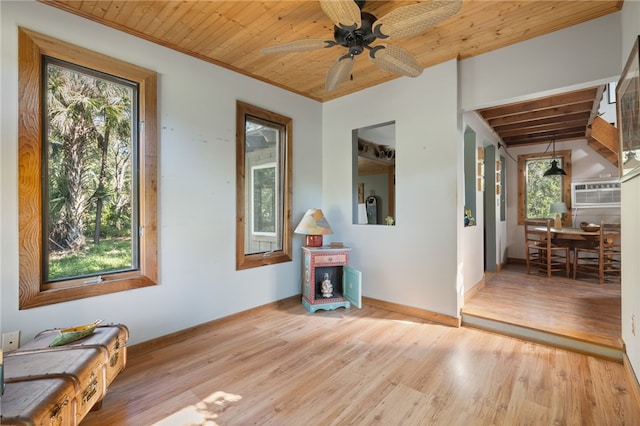 miscellaneous room with ceiling fan, light hardwood / wood-style floors, a wealth of natural light, and wood ceiling