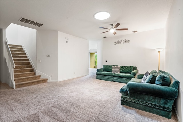 carpeted living room featuring ceiling fan