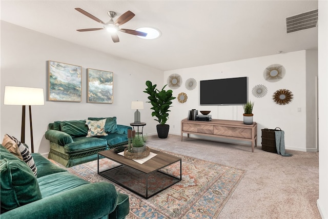 carpeted living room featuring ceiling fan