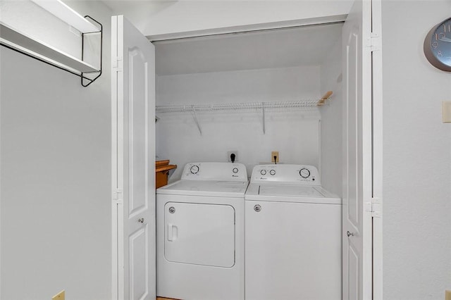 laundry room featuring washing machine and clothes dryer