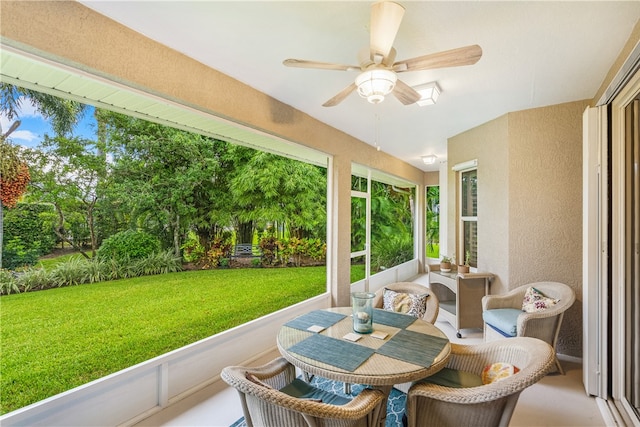 sunroom / solarium with ceiling fan