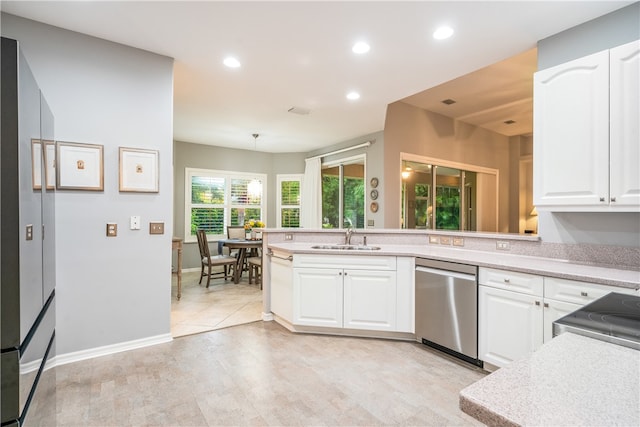 kitchen with white cabinetry, decorative light fixtures, sink, dishwasher, and light colored carpet