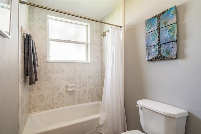 bathroom with toilet and shower / bath combo