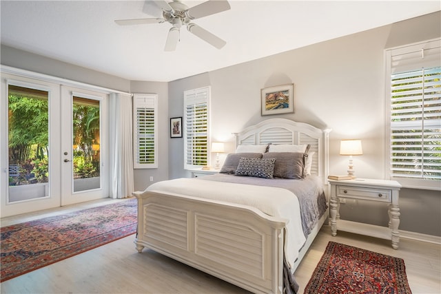 bedroom with light hardwood / wood-style floors, french doors, ceiling fan, and access to exterior