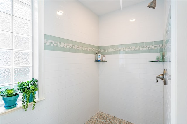 bathroom featuring tiled shower