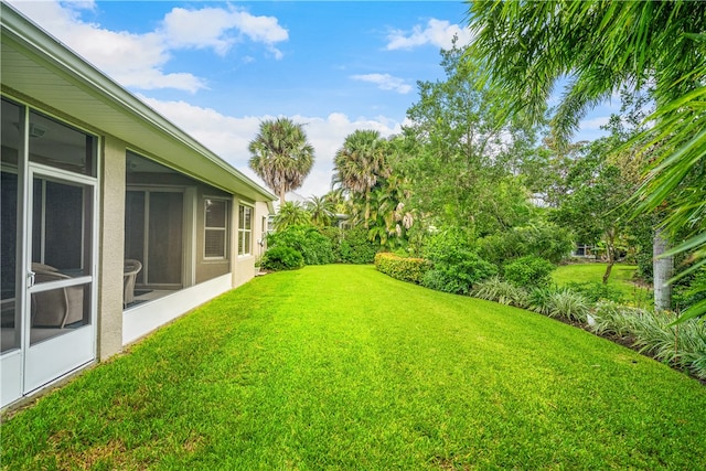 view of yard with a sunroom