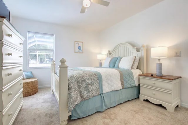 carpeted bedroom with baseboards and ceiling fan