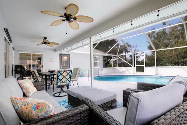 outdoor pool featuring outdoor dining space, an outdoor living space, glass enclosure, and a patio