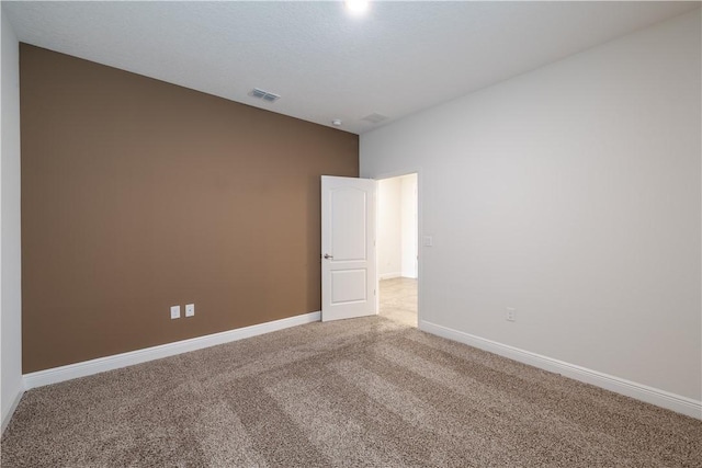 empty room with carpet flooring