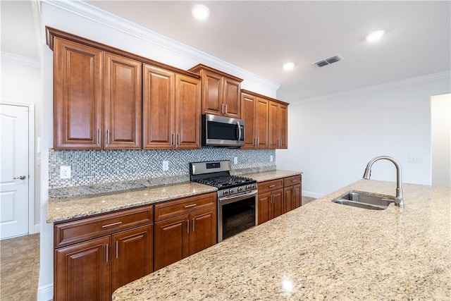 5964 Long Leaf Ln, Vero Beach, FL 32966 - kitchen featuring stainless steel appliances, a sink, crown molding, light stone counters, and backsplash