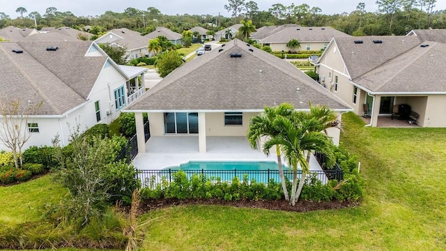 5964 Long Leaf Ln, Vero Beach, FL 32966 - back of house with a patio, a shingled roof, stucco siding, and a residential view