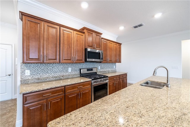 kitchen featuring decorative backsplash, appliances with stainless steel finishes, ornamental molding, and sink