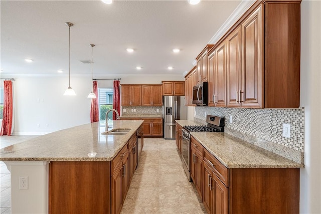 5964 Long Leaf Ln, Vero Beach, FL 32966 - kitchen featuring appliances with stainless steel finishes, a sink, brown cabinetry, backsplash, and a large island