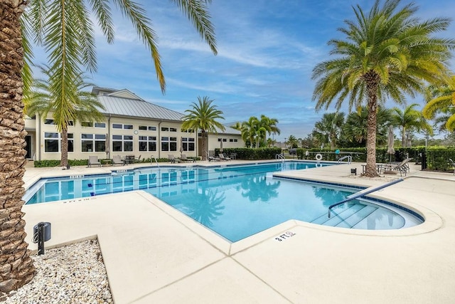 view of swimming pool with a patio