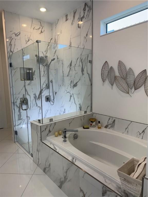 bathroom with a marble finish shower, a bath, and recessed lighting