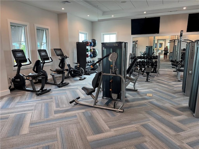 exercise room featuring carpet, visible vents, and recessed lighting