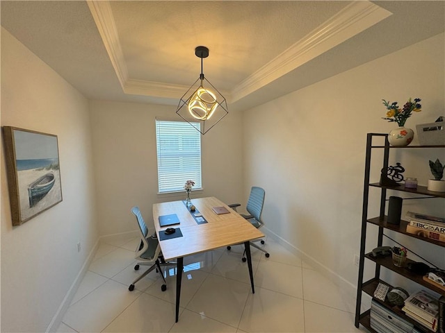 office space with a raised ceiling, crown molding, baseboards, and light tile patterned floors