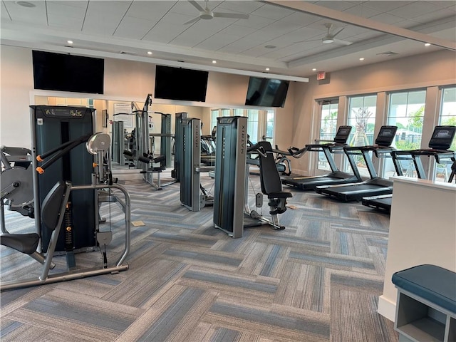 exercise room with carpet floors and recessed lighting