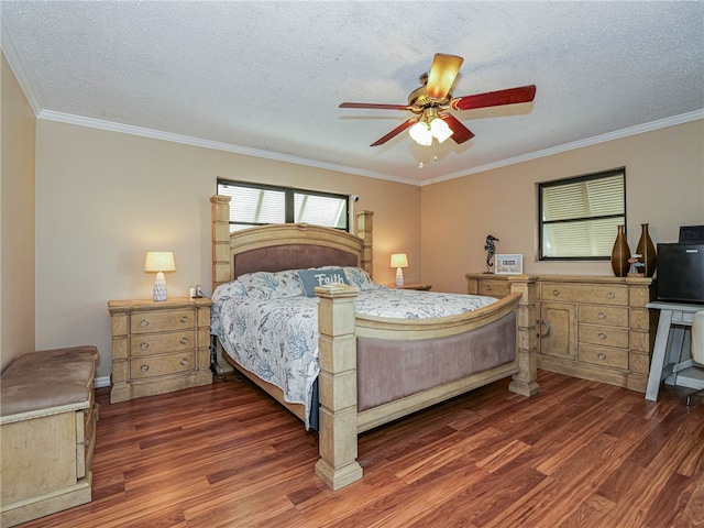 bedroom featuring a textured ceiling, dark hardwood / wood-style flooring, ceiling fan, and ornamental molding