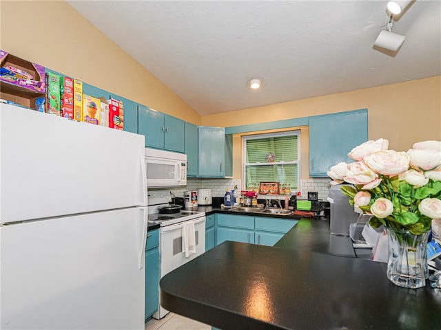 kitchen featuring tasteful backsplash, white appliances, blue cabinets, vaulted ceiling, and sink