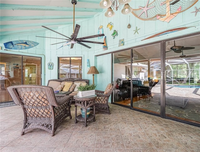 sunroom featuring lofted ceiling