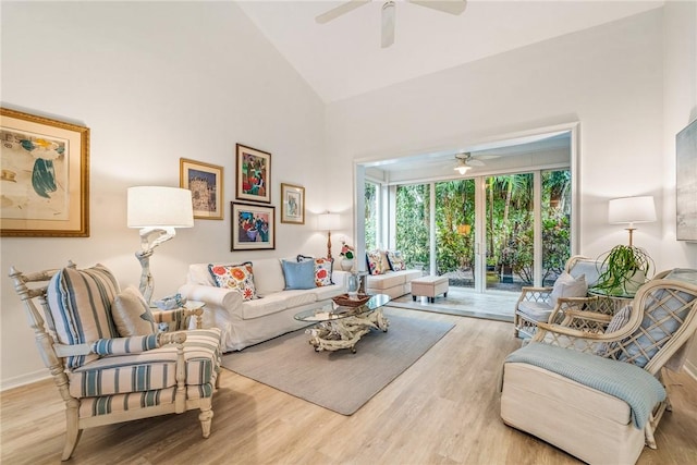 living room with ceiling fan, high vaulted ceiling, and hardwood / wood-style flooring