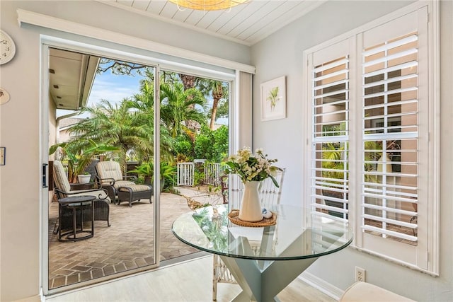 doorway to outside featuring hardwood / wood-style flooring and wooden ceiling