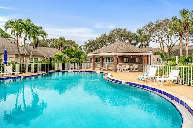 view of swimming pool with a patio area