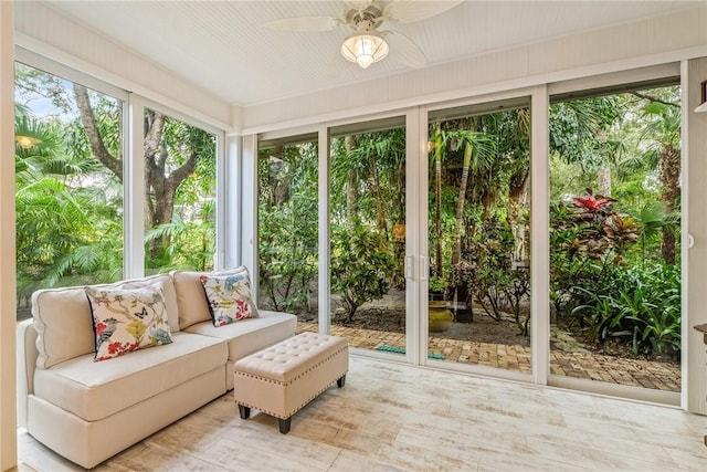 sunroom featuring ceiling fan