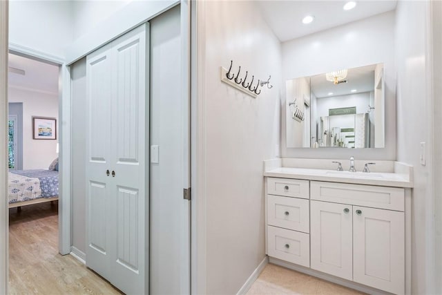 bathroom with wood-type flooring and vanity