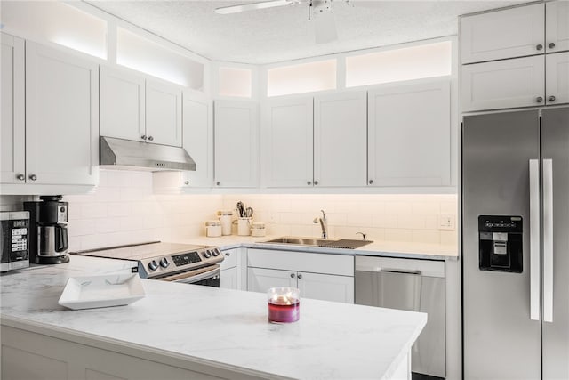 kitchen with white cabinets, sink, and appliances with stainless steel finishes