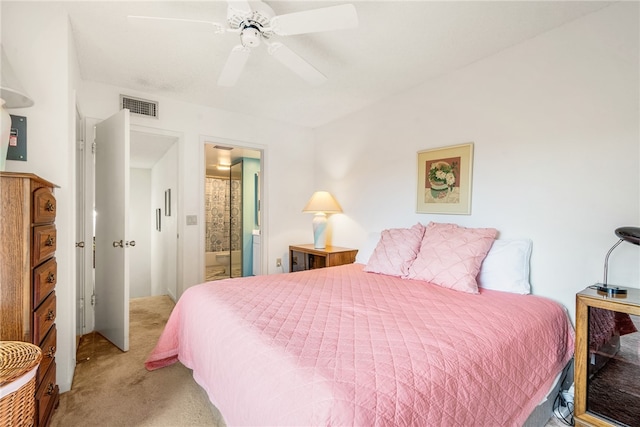 carpeted bedroom featuring ensuite bathroom and ceiling fan