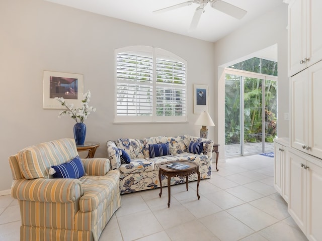 living room with ceiling fan and light tile patterned floors