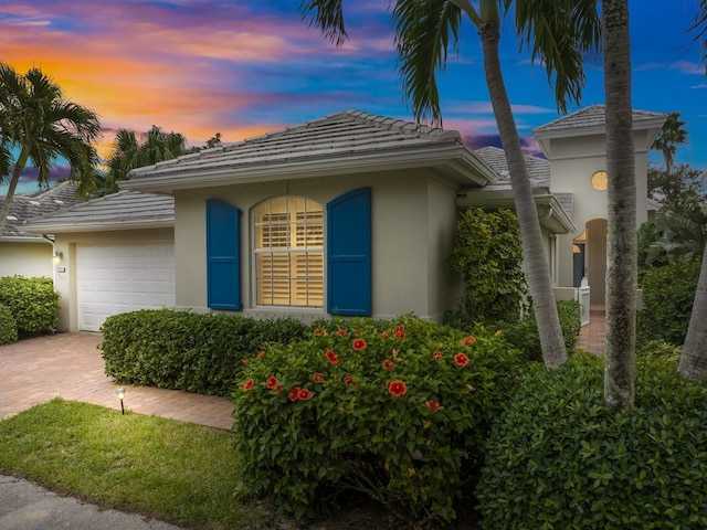 view of front of home with a garage