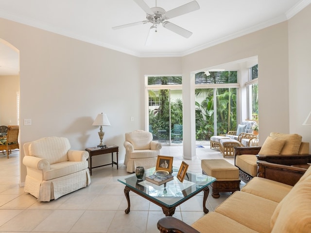 living room featuring light tile patterned floors, ceiling fan, and crown molding