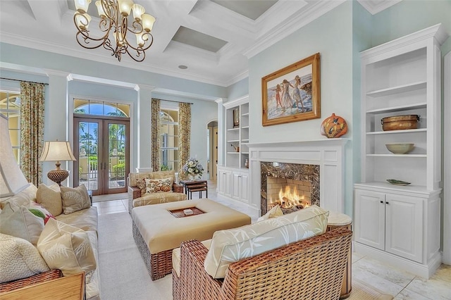 411 S Palm Island Cir, Vero Beach, FL 32963 - living area featuring crown molding, built in shelves, a chandelier, a fireplace, and coffered ceiling