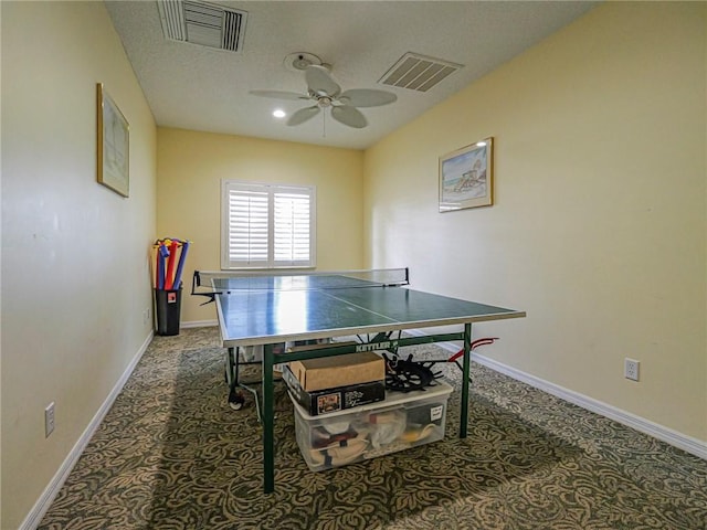 recreation room with ceiling fan, carpet, visible vents, and baseboards