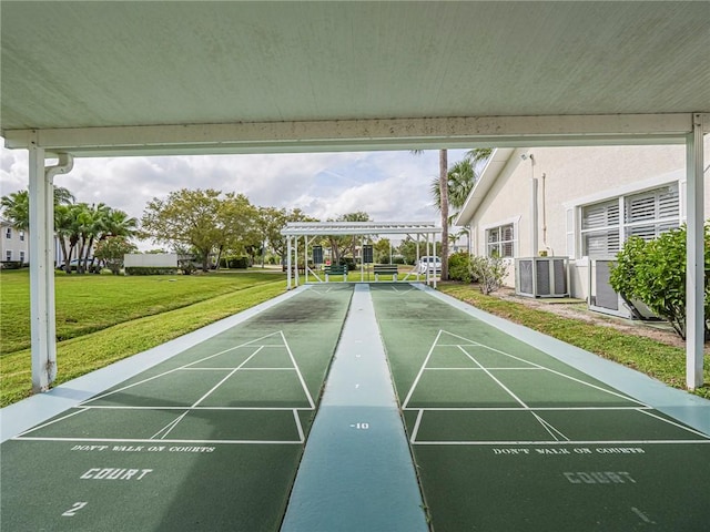 surrounding community with shuffleboard and a yard