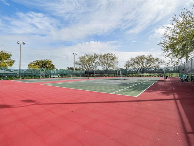 view of sport court featuring community basketball court and fence