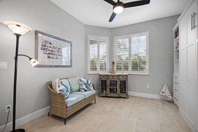 sitting room featuring ceiling fan and light wood-type flooring