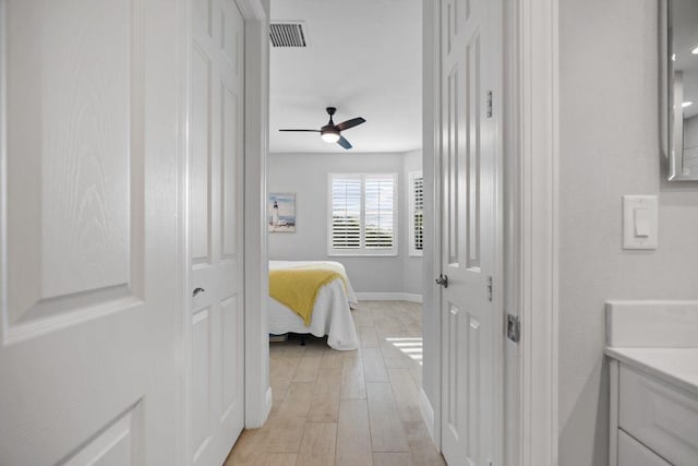 interior space featuring light wood-type flooring and ceiling fan