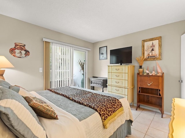 2800 Indian River Blvd Unit 2S, Vero Beach, FL 32960 - bedroom with access to exterior and light tile patterned floors