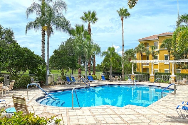 view of swimming pool with a pergola and a patio area