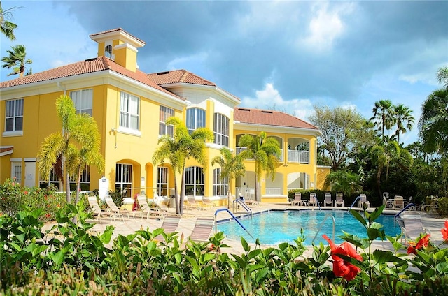 view of swimming pool featuring a patio area