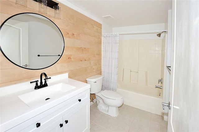 full bathroom with wood walls, tile patterned flooring, vanity, toilet, and shower / bathtub combination with curtain